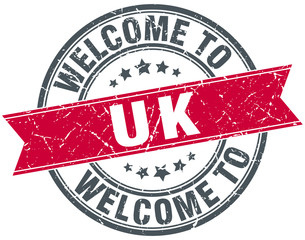 welcome to uk red round vintage stamp