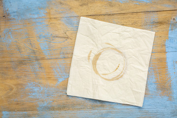 napkin with coffee stains on wood