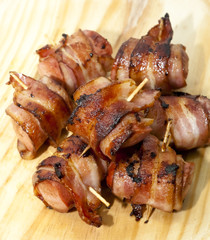 Deep fried sausages rolled in bacon