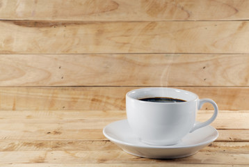 Coffee cup / Coffee cup and saucer on wood background.