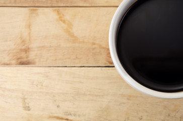 Coffee cup / Coffee cup on wood background, top view.