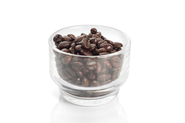 Roasted coffee beans / Roasted coffee beans in glass on a white background.