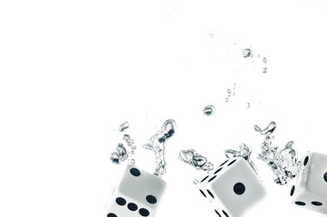 Dice dropped into the water, on a white background.