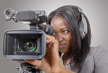 young African American women with professional video camera and