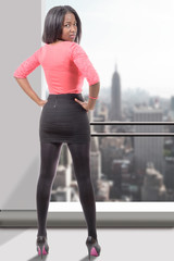 Obraz premium African American businesswoman , city in background, back view