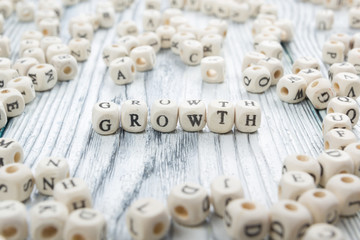 text of Growth on cubes. Wooden ABc