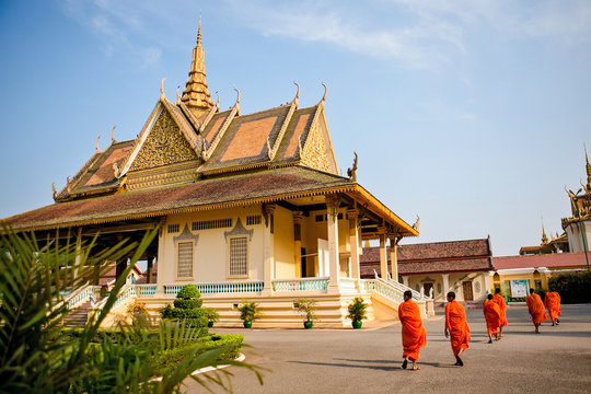 Monks walking in front of Royal Palace in Phnom Penh Cambodia