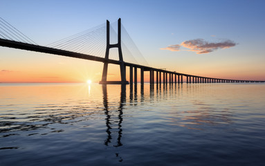 Fototapeta na wymiar Vasco da Gama bridge, sunrise at lisbon