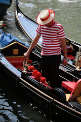 Gondolier standing in gondola © Volodymyr