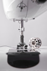 Front detail sewing machine needle and thread spool