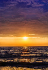 Fototapeta na wymiar dramatic colorful sunset over the sea