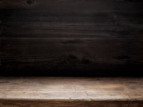 wooden table and dark wooden wall