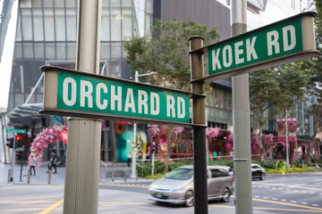 Schilderijen op glas Street signs Orchard Road and Koek Road in Singapore © Stanislav Komogorov