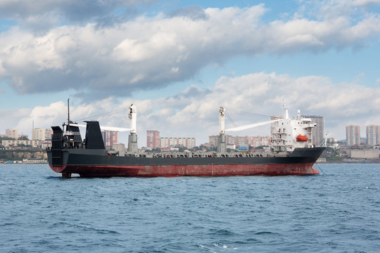 Ship of dry cargo on a background Vladivostok