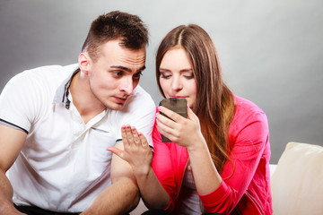 Couple use mobile phone texting messages