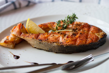 Grilled humpback salmon with a lemon slice