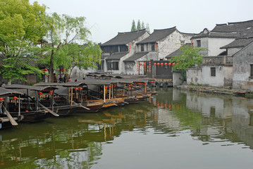 Fototapeta na wymiar Shanghai, boats and old houses at the Xitang ancient town.
