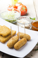 croquettes balls and different kind of sauces on a plate on a cl