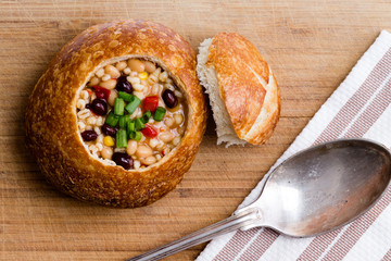 Top down view of bread bowl with bean soup