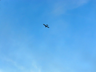 light private airplane against blue sky