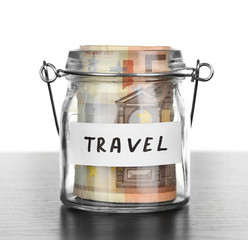 Jar for savings full of banknotes