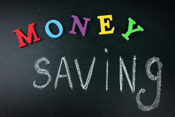 Money saving concept on a blackboard background