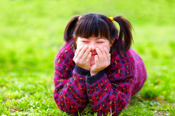 happy young girl with disability on spring lawn