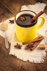 Hot black tea with cinnamon in a ceramic mug. Tinted.
