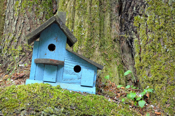 Decorative blue wooden birdhouse