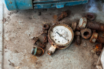 Old meter in dirty place .