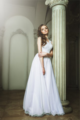 Fototapeta premium Beautiful Blonde Bride Woman. White Wedding Dress. Vintage Grung