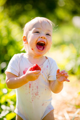 Little child with strawberry