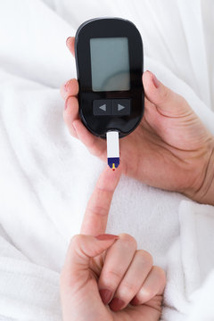 Woman Hand With Glucometer