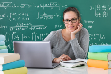 Woman Writing With Pen In Book