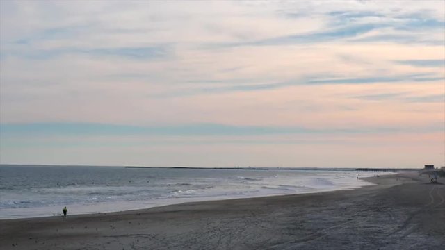 View of a Lifeguard Tower at the beach with Seagulls Flying Passed It