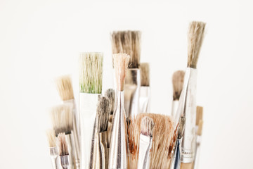 Artist's paint brushes with traces of old paint in bristles