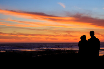Couple At Sunset On Beach