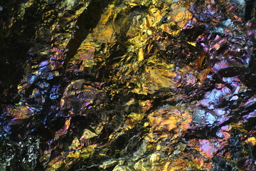 Fototapeta na wymiar Microscope image of colorful copper ore. This is copper sulphide called Chalcopyrite, It has the chemical formula (CuFeS2).