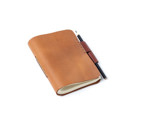 Brown Leather notebooks with pencil isolated on white background