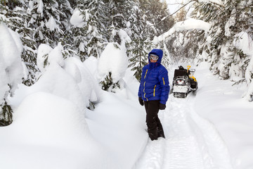 Woman in the winter forest.