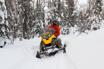 Athlete on a snowmobile.