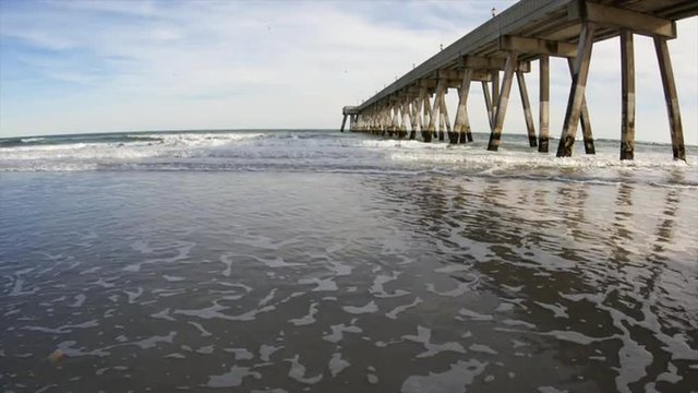 View of a Lifeguard Tower at the beach with Seagulls Flying Passed It