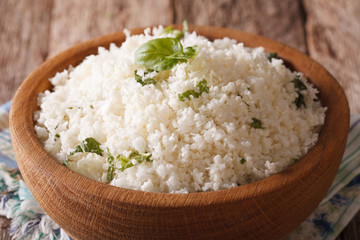 Paleo Food: Cauliflower rice with herbs close-up. horizontal
