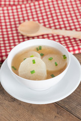 White radish soup in white bowl.