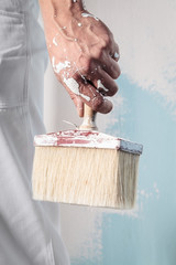 Workman Hand holding Dirty Paintbrush - 102569901