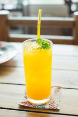 Orange juice on the table. Selective focus.