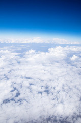 Blue sky background with tiny clouds