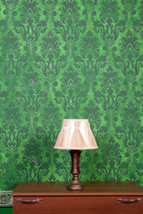 Vintage lamp on chimney on green retro pattern background