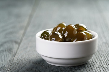 sweet green olives in syrup in bowl