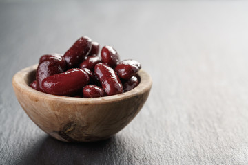 red beans from can in wood bowl